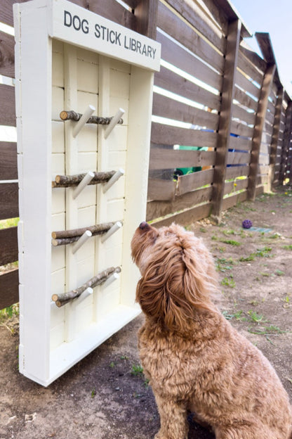 Beige Dog Stick Library in backyard setting showing natural wood finish