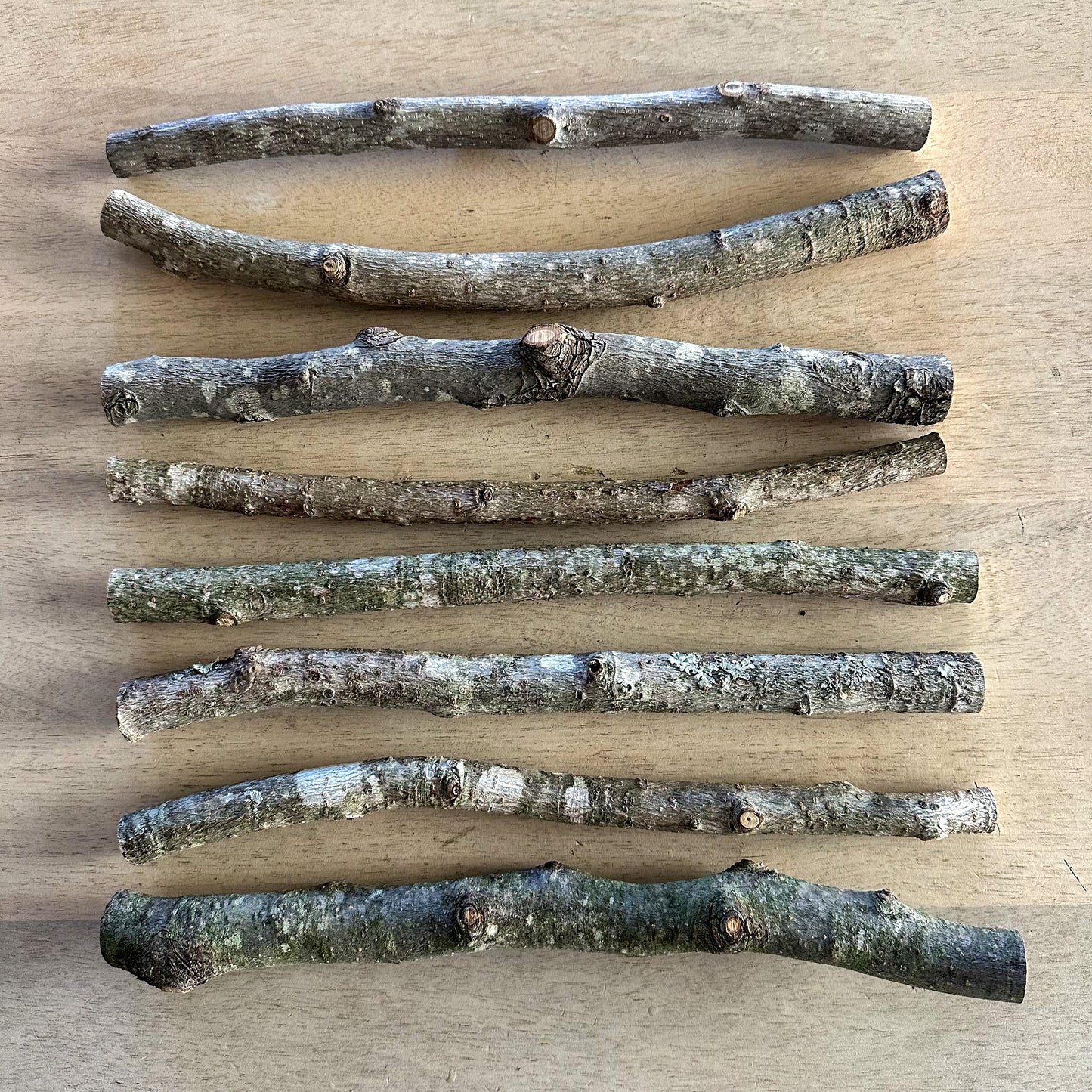 Close-up of natural wood sticks showing unique grain and knots