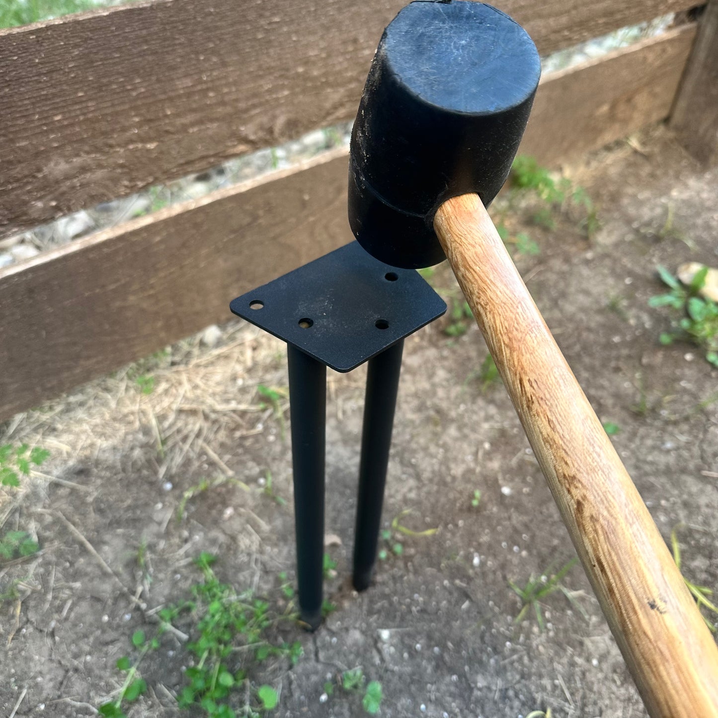 Ground anchor add-on for Dog Stick Library installed in yard