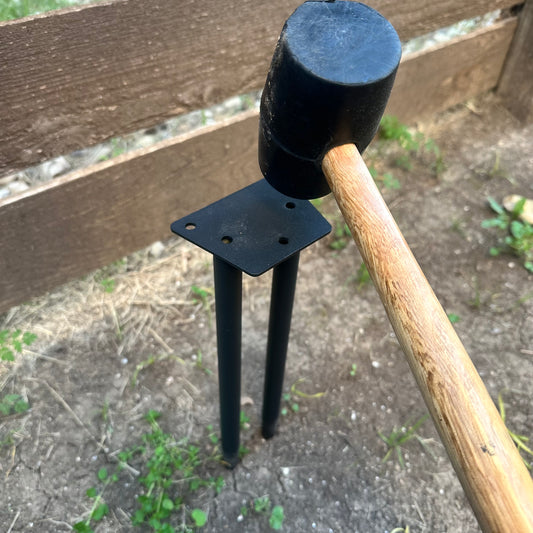Ground anchor add-on for Dog Stick Library installed in yard